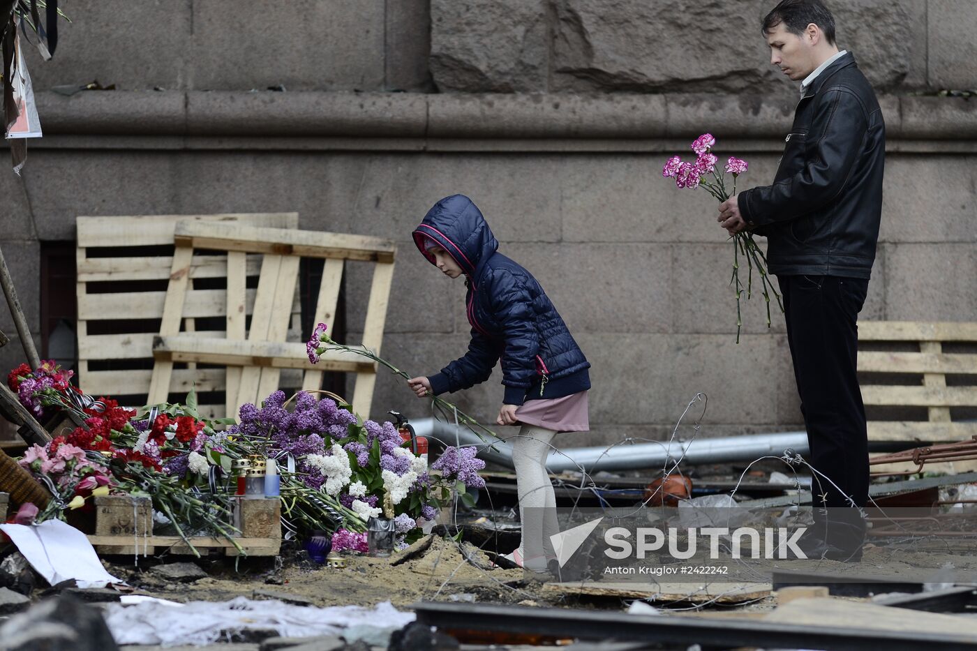 Flowers to commemorate memory of those who died from fire at Odessa's House of Trade Unions