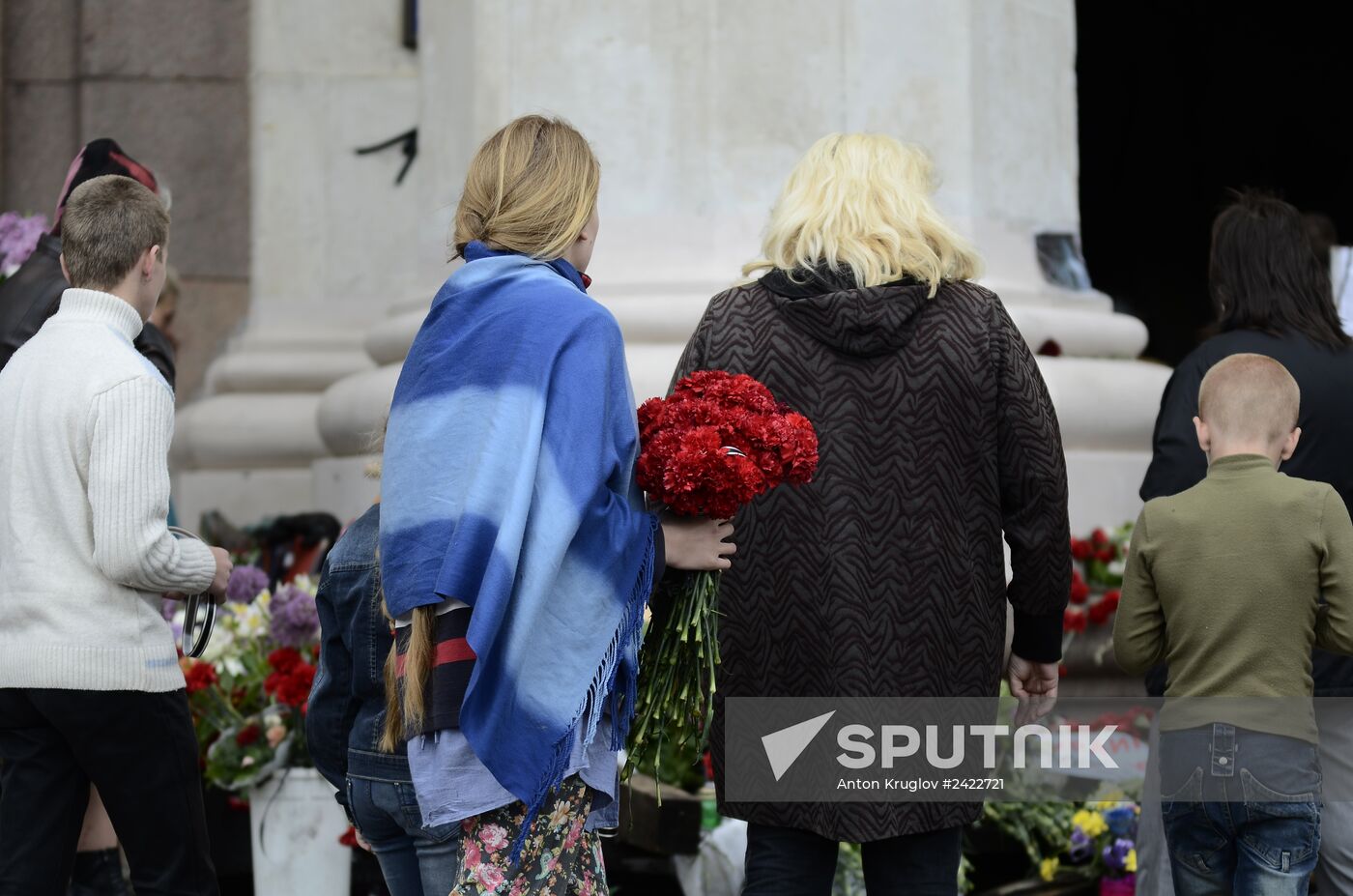 Odessits bring flowers in memory of people killed by fire in Trade Unions House