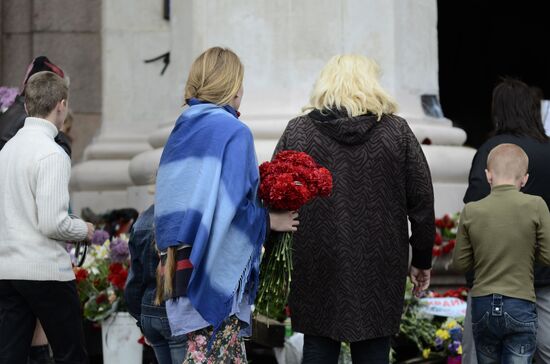 Odessits bring flowers in memory of people killed by fire in Trade Unions House