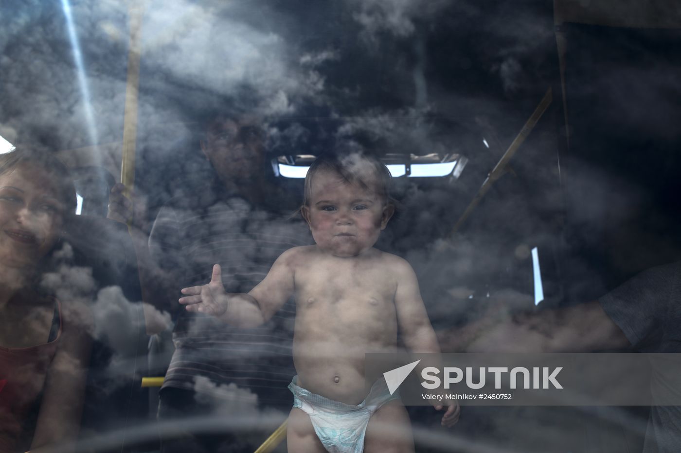 Refugees at Izvarino border checkpoint in Lugansk Region