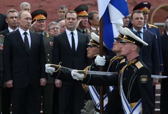 Putin and Medvedev lay flowers at the Tomb of the Unknown Soldier at the Kremlin Wall