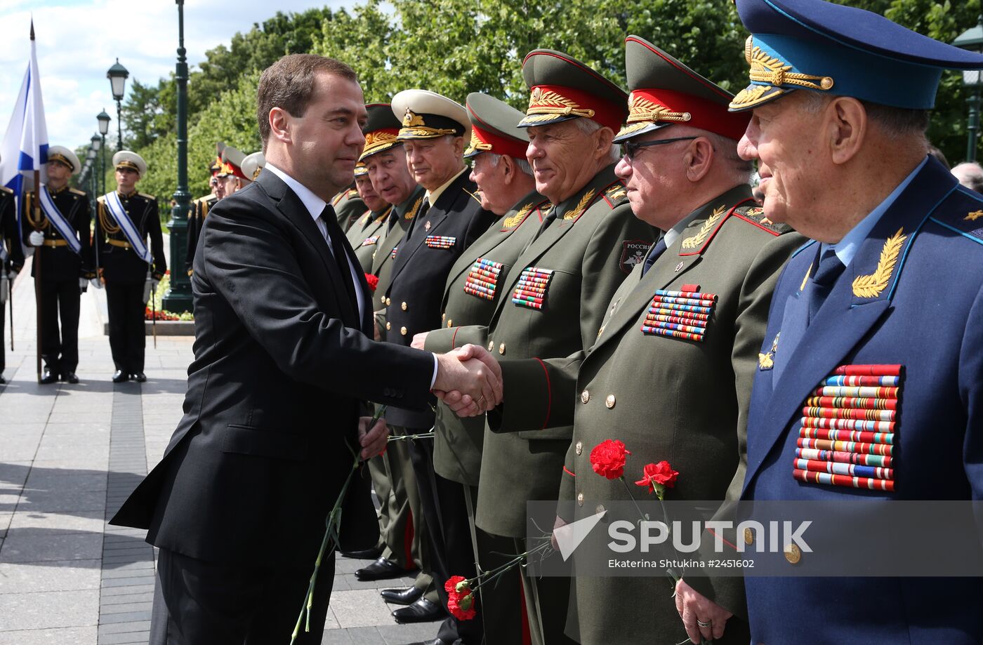 Vladimir Putin and Dmitry Medvedev lay flowers at Tomb of Unknown Soldier near Kremlin Wall