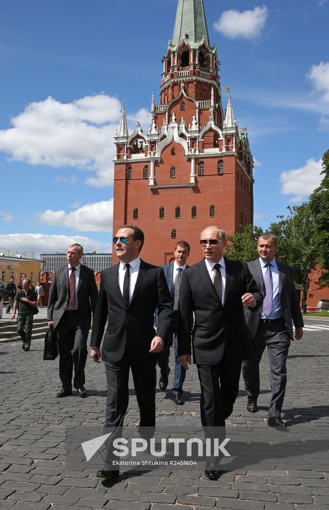 Vladimir Putin and Dmitry Medvedev lay flowers at Tomb of Unknown Soldier near Kremlin Wall