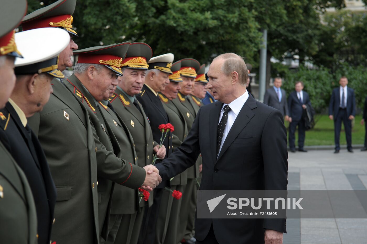 Vladimir Putin and Dmitry Medvedev lay flowers at Tomb of Unknown Soldier near Kremlin Wall