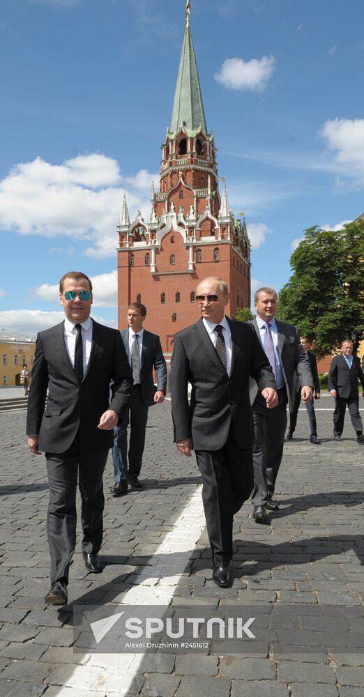 Vladimir Putin and Dmitry Medvedev lay flowers at Tomb of Unknown Soldier near Kremlin Wall