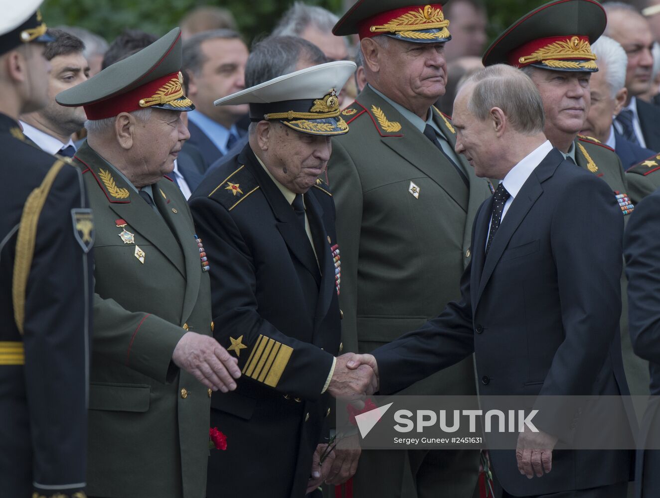 Vladimir Putin and Dmitry Medvedev lay flowers at Tomb of Unknown Soldier near Kremlin Wall