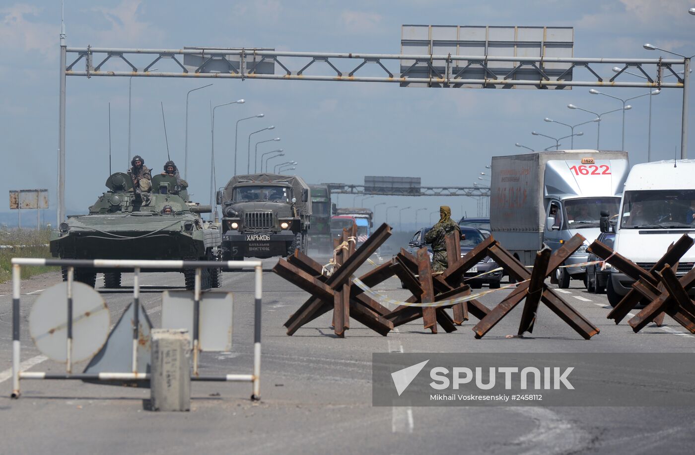 Column of self-defense forces vehicles enter Donetsk