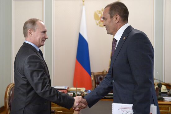 Vladimir Putin at a working meeting with Mikhail Ignatyev