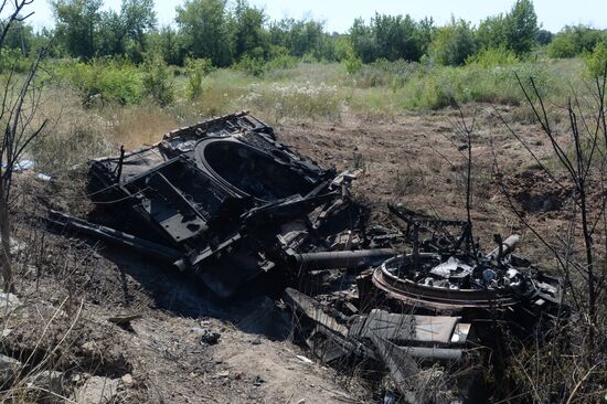 Ukrainian army's military equipment destroyed by militia at the entrance to Donetsk