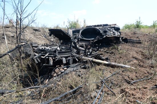 Ukrainian army's military equipment destroyed by militia at the entrance to Donetsk