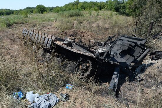 Ukrainian army's military equipment destroyed by militia at the entrance to Donetsk