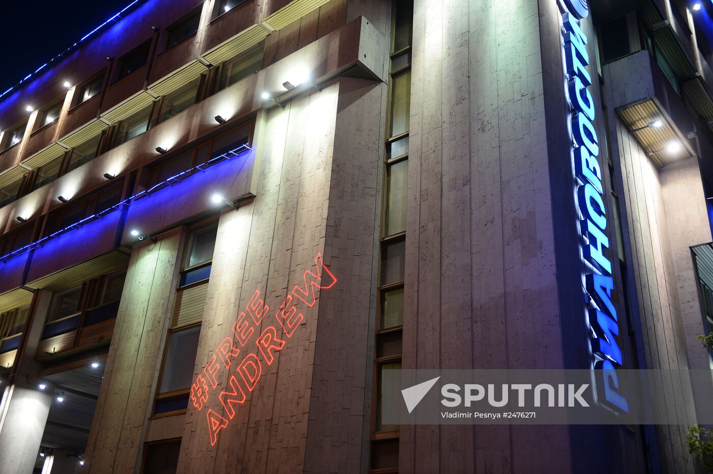 Hashtags in support of Andrei Stenin projected on Rossiya Segodnya building