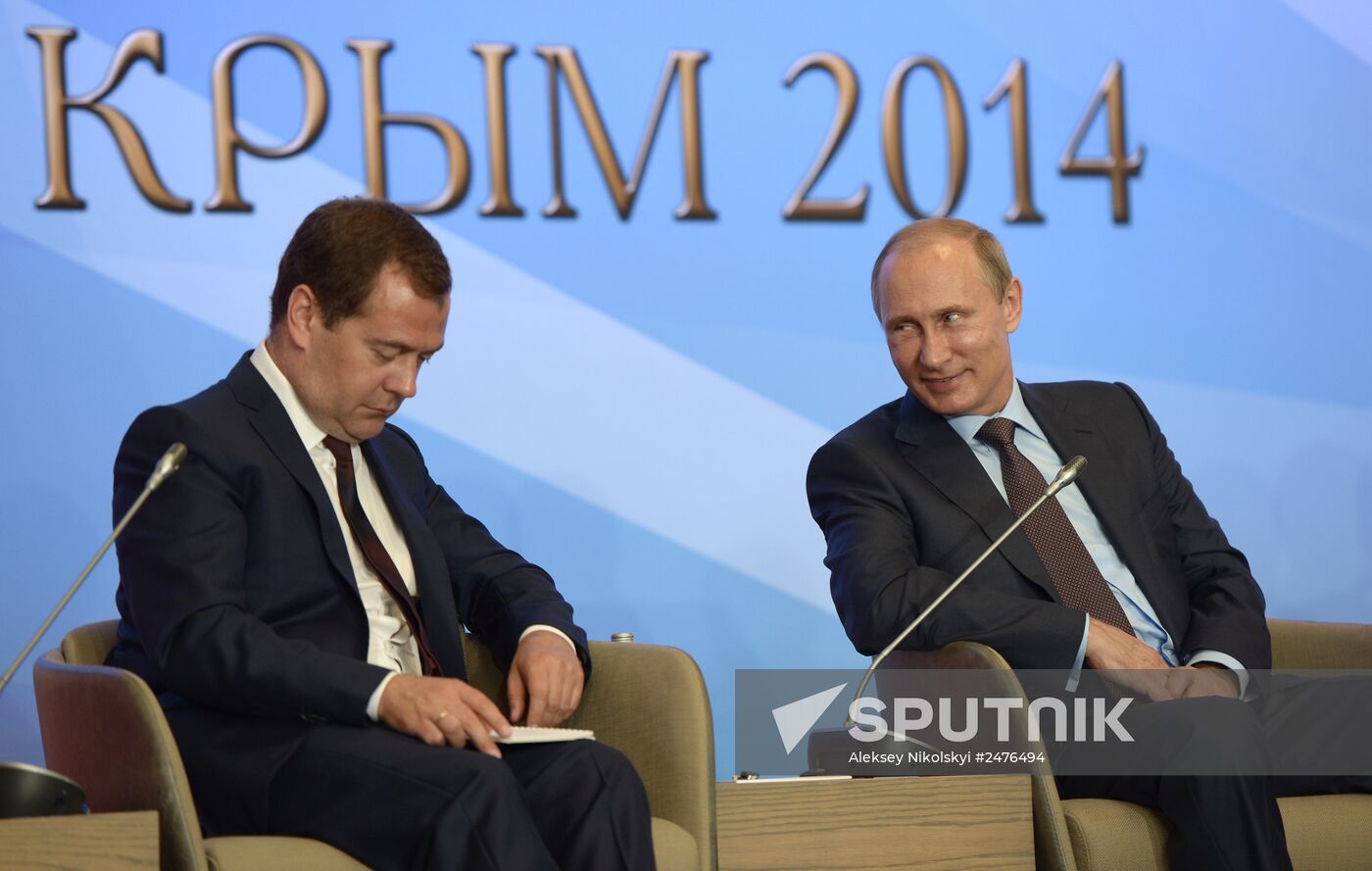 August 14, 2014. Russian President Vladimir Putin, right, and Russian Prime Minister Dmitry Medvedev during a meeting with members of State Duma parliamentary parties in Yalta. Location: Russia, Crimean Federal District, Yalta. Author: Aleksey Nikolskyi/Sputnik. Vladimir Putin's working visit to Crimean Federal District. Day Two