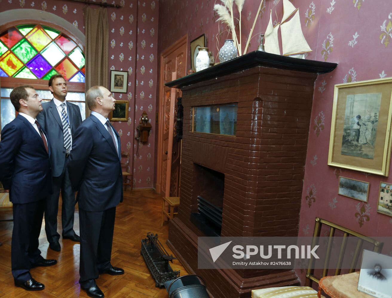 August 14, 2014. Russian President Vladimir Putin on a tour of the Anton Chekhov House-Museum in Yalta. From left: Russian Prime Minister Dmitry Medvedev, the Museum's director Alexander Titorenko. Location: Russia, Crimean Federal District, Yalta. Author: Dmitry Astakhov/Sputnik. Vladimir Putin's working visit to Crimean Federal District. Day Two