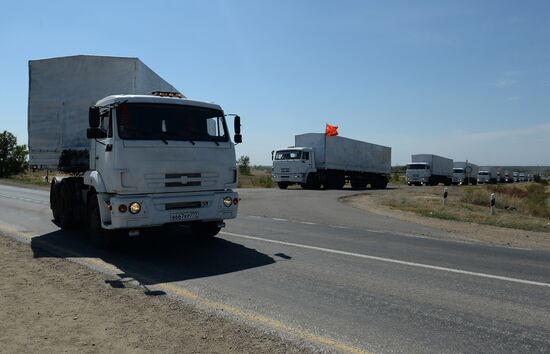 Russian humanitarian convoy trucks arrive at checkpoint at Russian-Ukrainian border