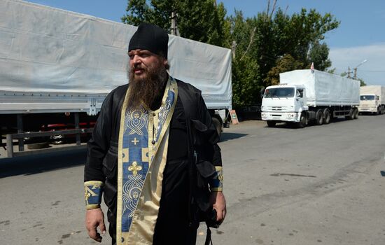 Russian humanitarian convoy trucks arrive at checkpoint at Russian-Ukrainian border