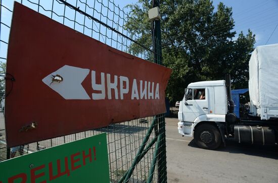 Russian humanitarian convoy trucks arrive at checkpoint at Russian-Ukrainian border