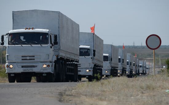 Russian humanitarian convoy trucks arrive at checkpoint at Russian-Ukrainian border