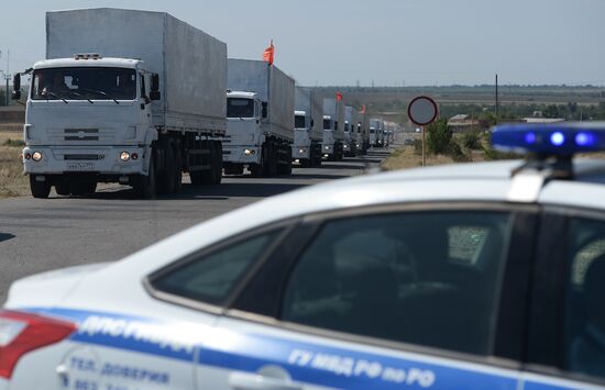 Russian humanitarian convoy trucks arrive at checkpoint at Russian-Ukrainian border