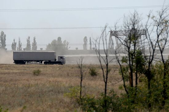 Russian humanitarian convoy trucks arrive at checkpoint at Russian-Ukrainian border