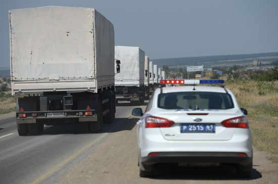 Russian humanitarian convoy trucks arrive at checkpoint at Russian-Ukrainian border