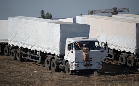 Russian humanitarian convoy trucks arrive at checkpoint at Russian-Ukrainian border