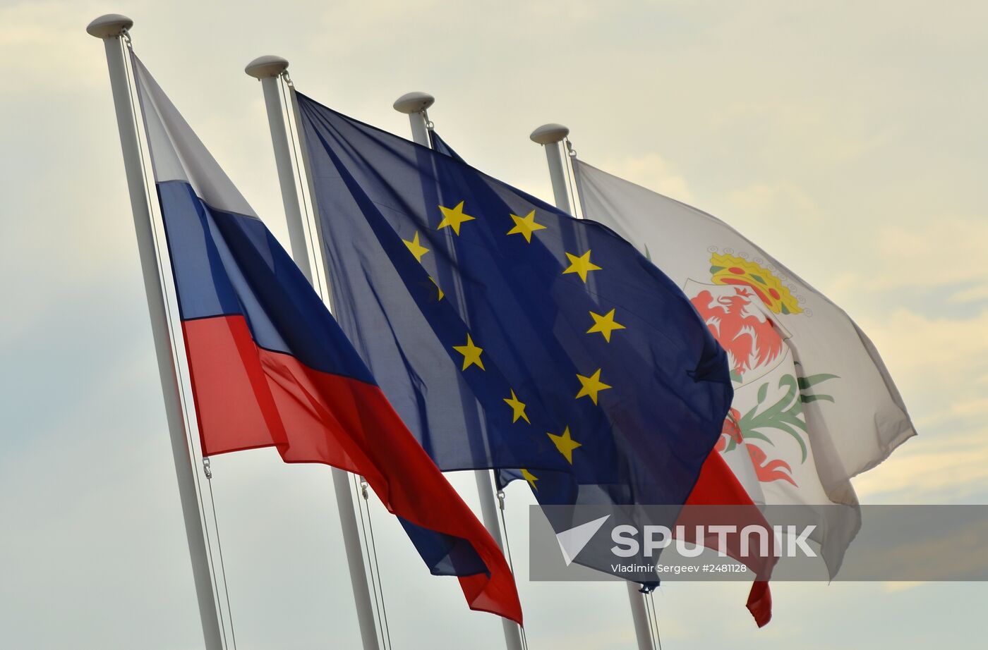 Flags of Russia, European Union, France and emblem of Nice on Nice embankment