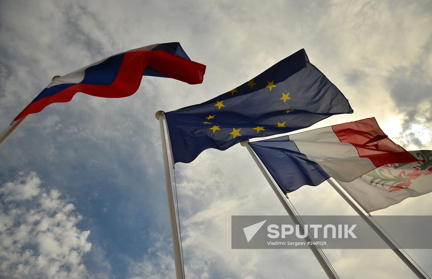 Flags of Russia, EU, France and coat of arms of Nice on the city's promenade