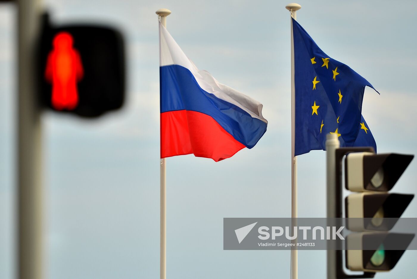 Flags of Russia, EU, France and coat of arms of Nice on the city's promenade