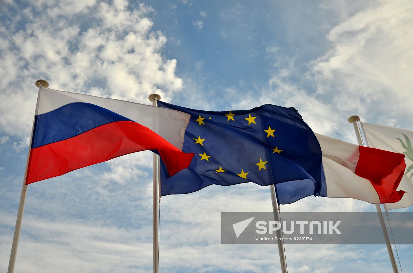 Flags of Russia, EU, France and coat of arms of Nice on the city's promenade