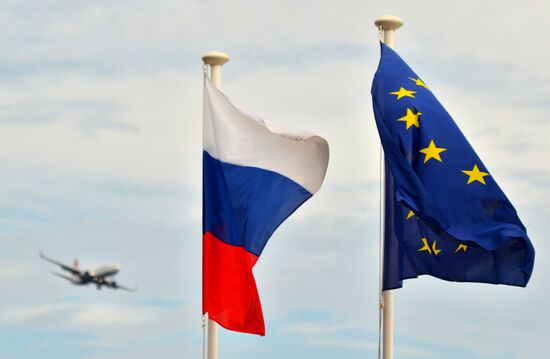 Flags of Russia, EU, France and coat of arms of Nice on the city's promenade