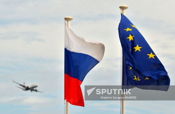 Flags of Russia, EU, France and coat of arms of Nice on the city's promenade