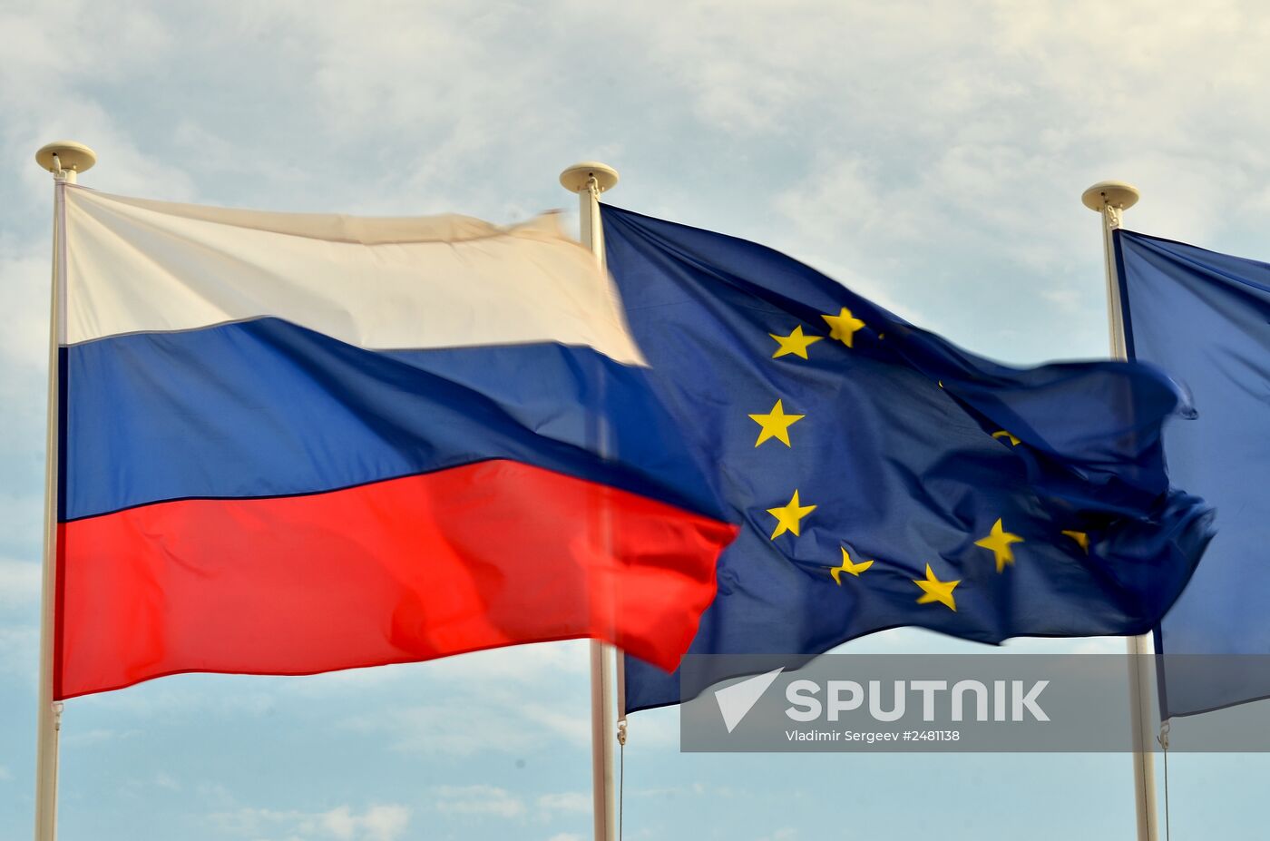 Flags of Russia, EU, France and coat of arms of Nice on the city's promenade