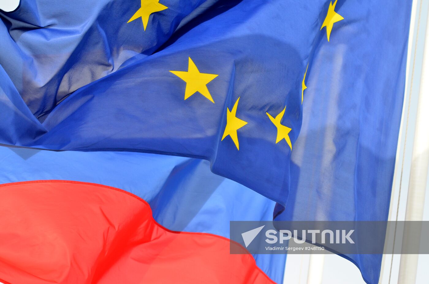 Flags of Russia, EU, France and coat of arms of Nice on the city's promenade