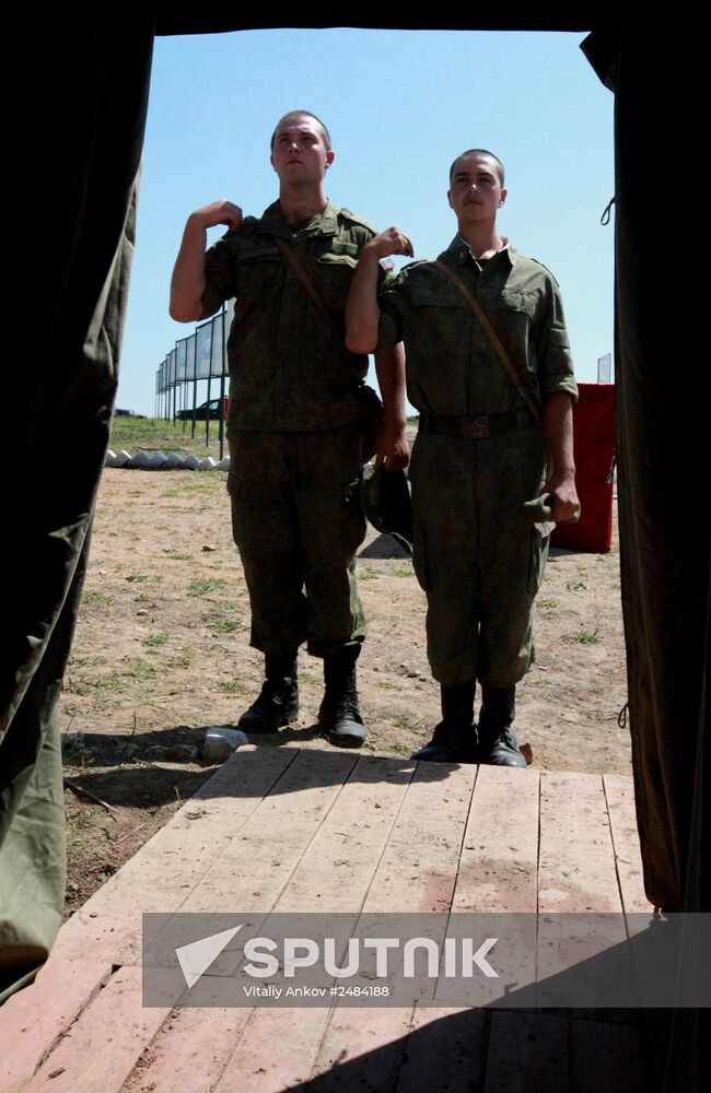 Consecrating makeshift church at fire-range of Sergeuevsky Training Center, Primorye Territory