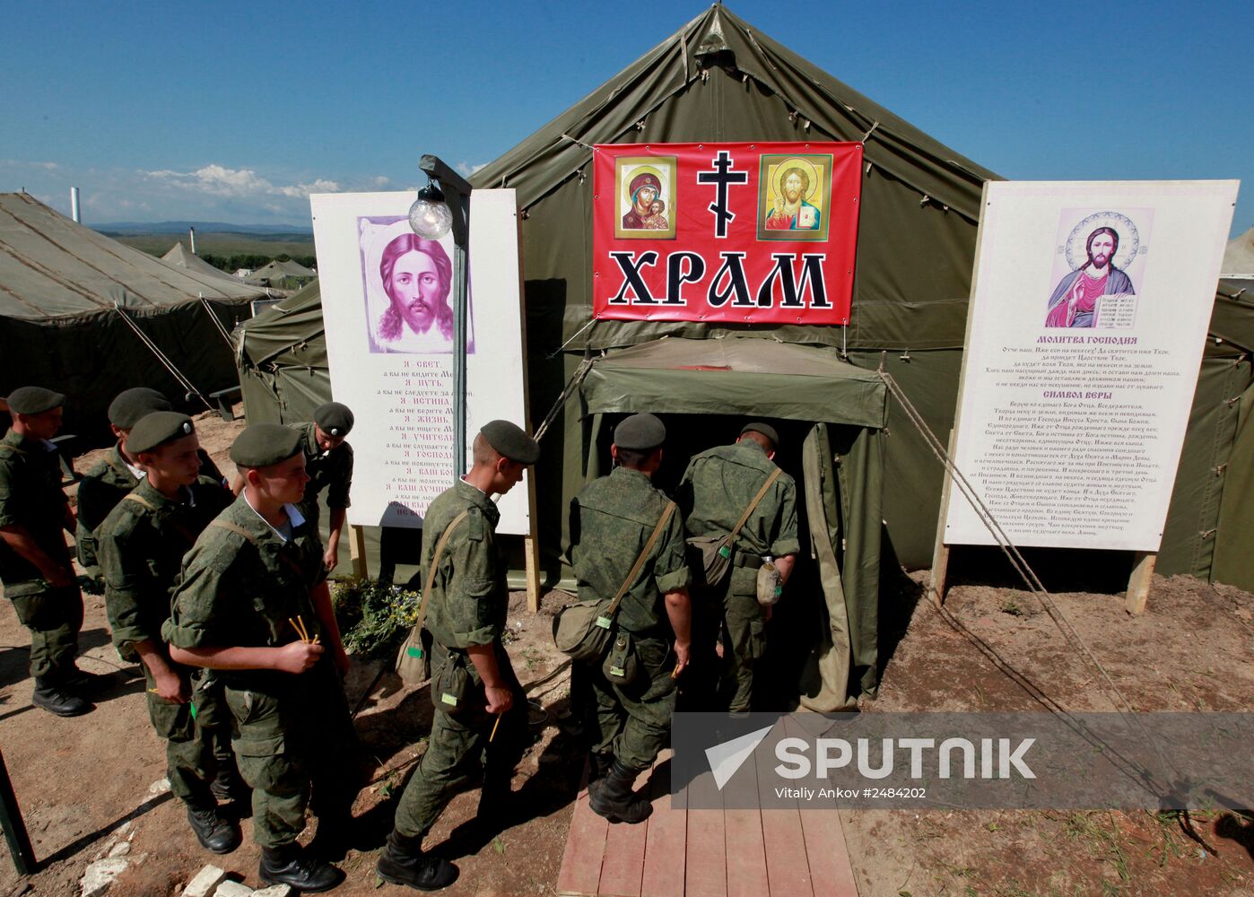 Consecrating makeshift church at fire-range of Sergeuevsky Training Center, Primorye Territory