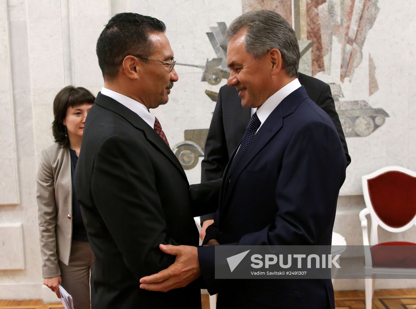 Russian Defense Minister Sergei Shoigu meets with his Malaysian counterpart Hishammuddin Hussein