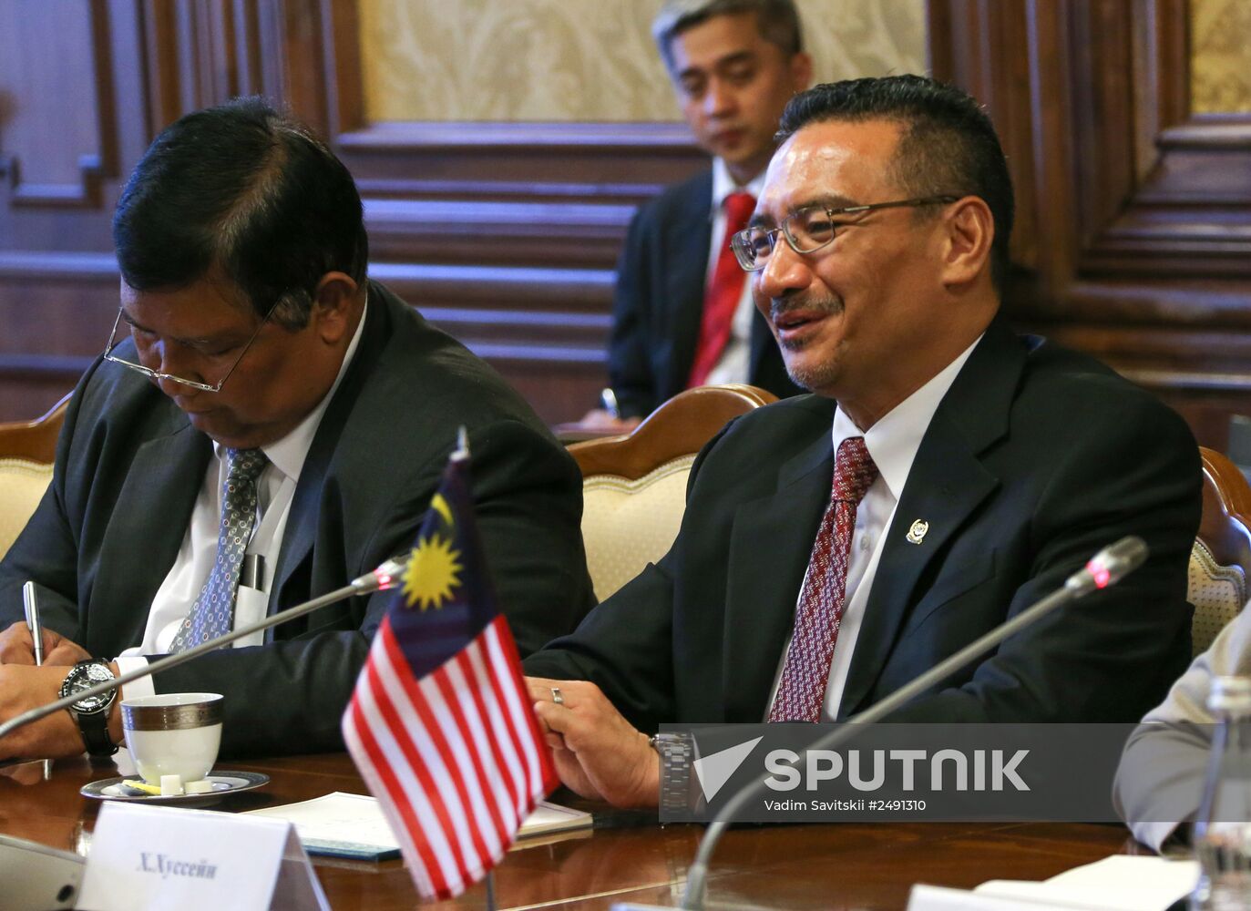 Russian Defense Minister Sergei Shoigu meets with his Malaysian counterpart Hishammuddin Hussein