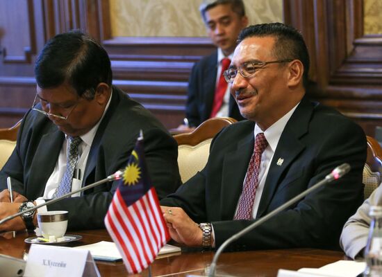 Russian Defense Minister Sergei Shoigu meets with his Malaysian counterpart Hishammuddin Hussein