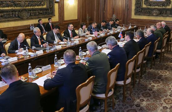 Russian Defense Minister Sergei Shoigu meets with his Malaysian counterpart Hishammuddin Hussein