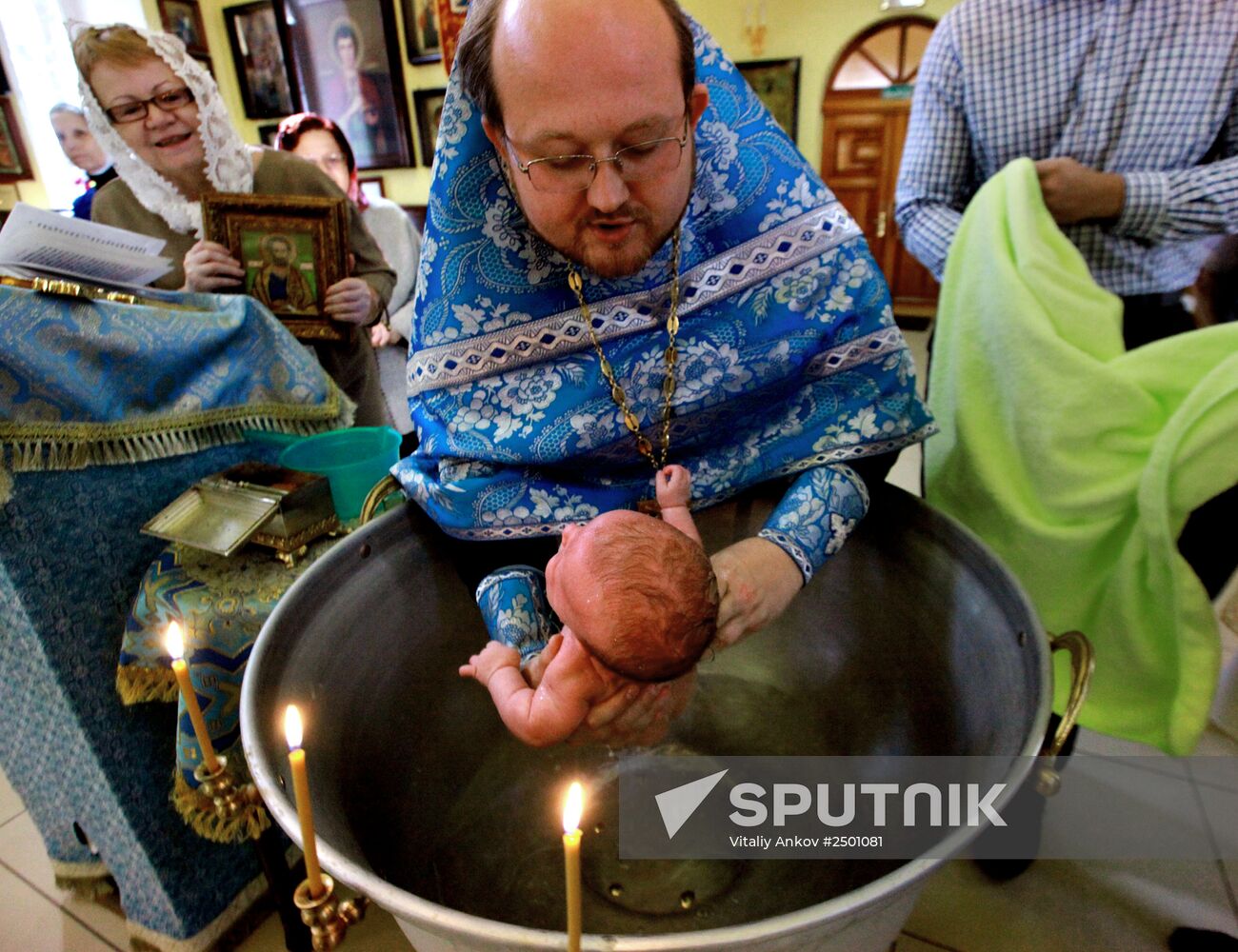 Baptizing an infant at the Church of St. Nicholas the Wonderworker in Vladivostok