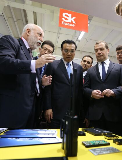 Dmitry Medvedev and Li Keqiang attend the Open Innovations International Forum