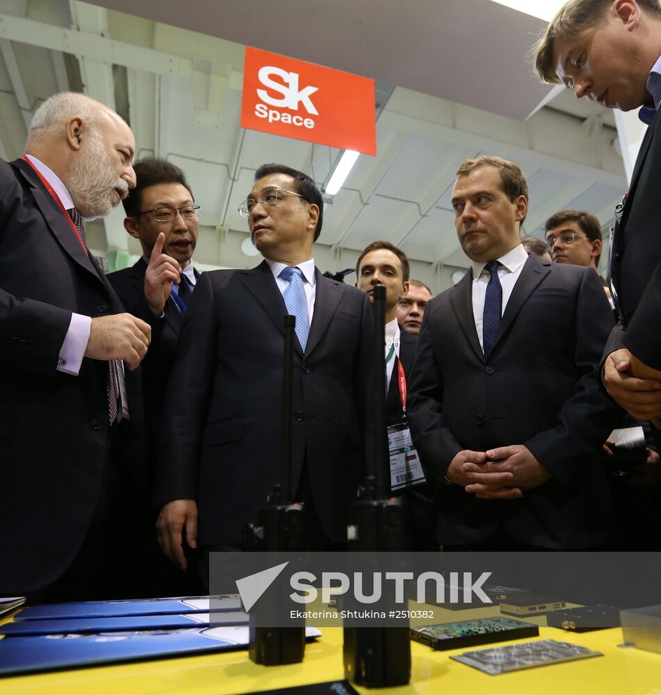 Dmitry Medvedev and Li Keqiang attend the Open Innovations International Forum