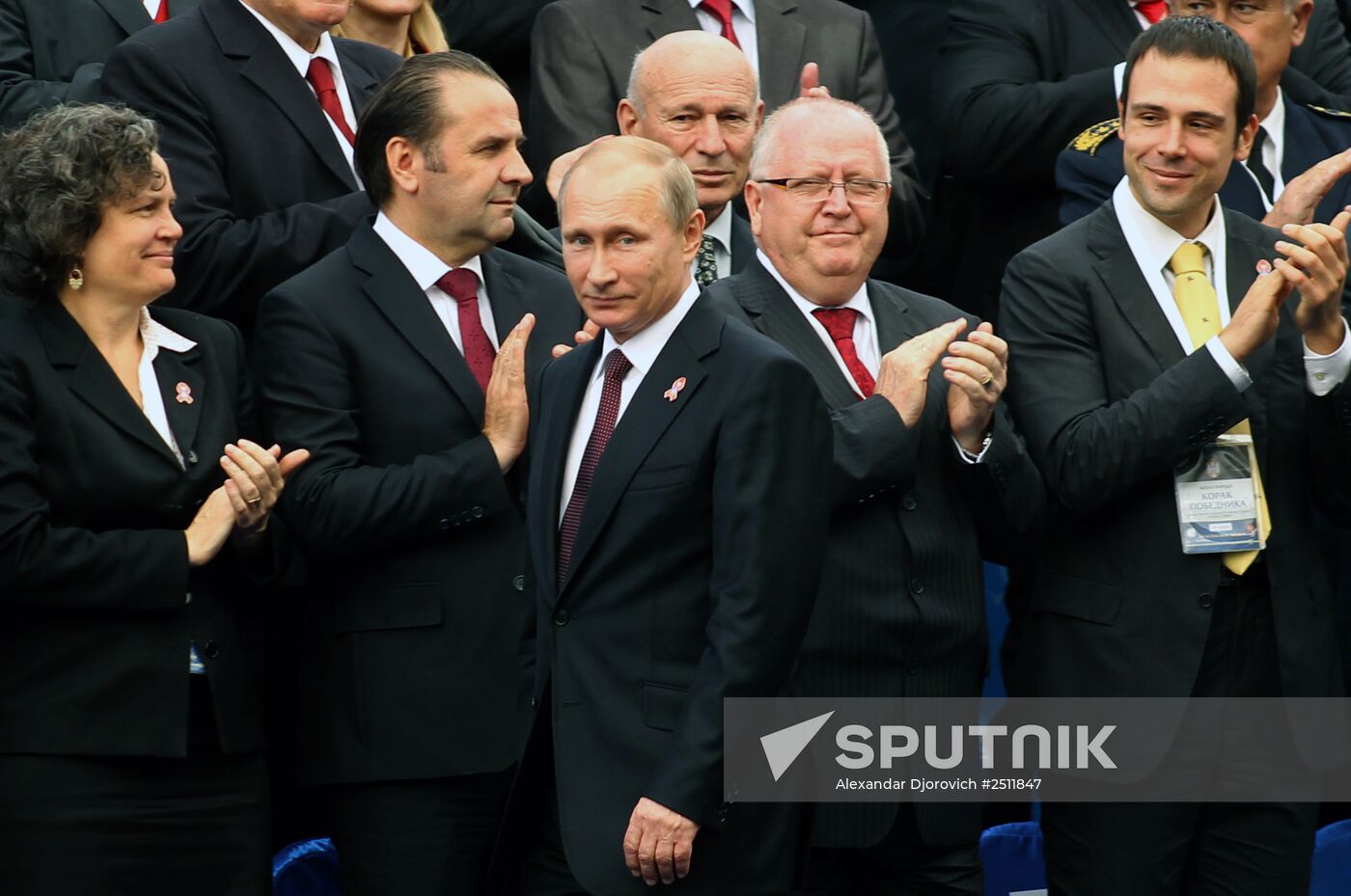 16 October 2014. Russian President Vladimir Putin (front) attends the 'Victor's March" military parade marking the 70th anniversary of the liberation of Belgrade from German fascist invaders. Location: Serbia, Belgrade. Author: Alexandar Djorovich/Sputnik. Vladimri Putin visits Serbia