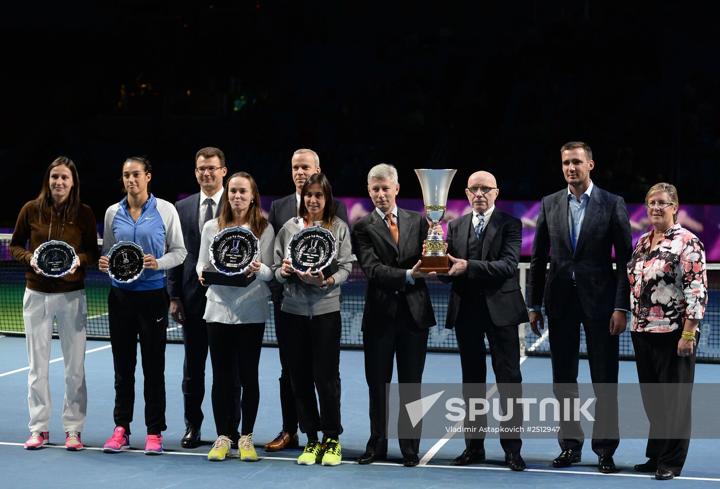 From left: Arantxa Parra-Santonja (Spain), Caroline Garcia (France), Martina Hingis (Switzerland), and Flavia Pennetta (Italy) winners of the Kremlin Cup women's doubles, pose for a photograph during the awarding ceremony at Olimpiysky Arena with the cups in their hands. Location: Russia, Moscow. Author: Vladimir Astapkovich/Sputnik. Tennis. 2014 Kremlin Cup. Day Six
