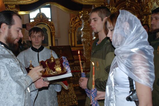 Wedding among volunteer DPR militias in Holy Transfiguration Cathedral in Donetsk