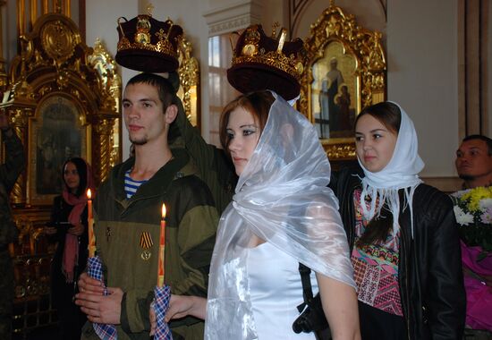 Wedding among volunteer DPR militias in Holy Transfiguration Cathedral in Donetsk