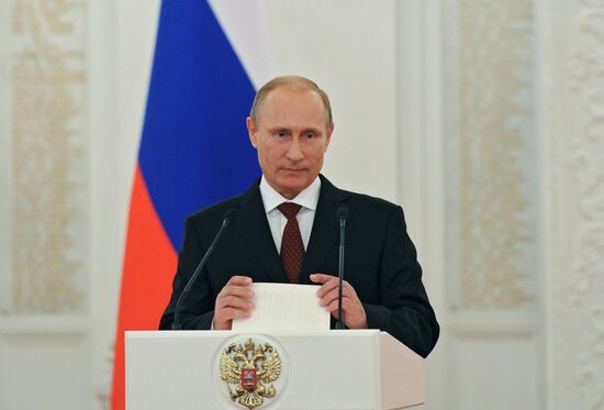 Vladimir Putin presents state awards to foreign citizens