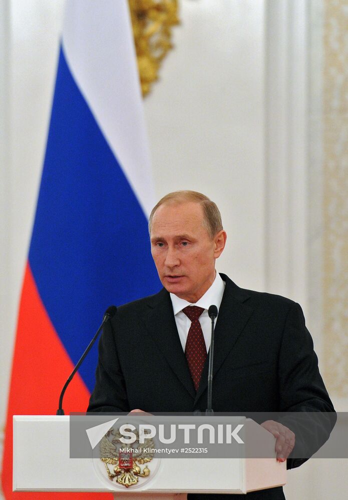 Vladimir Putin presents state awards to foreign citizens