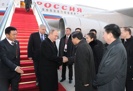 Vladimir Putin visits China